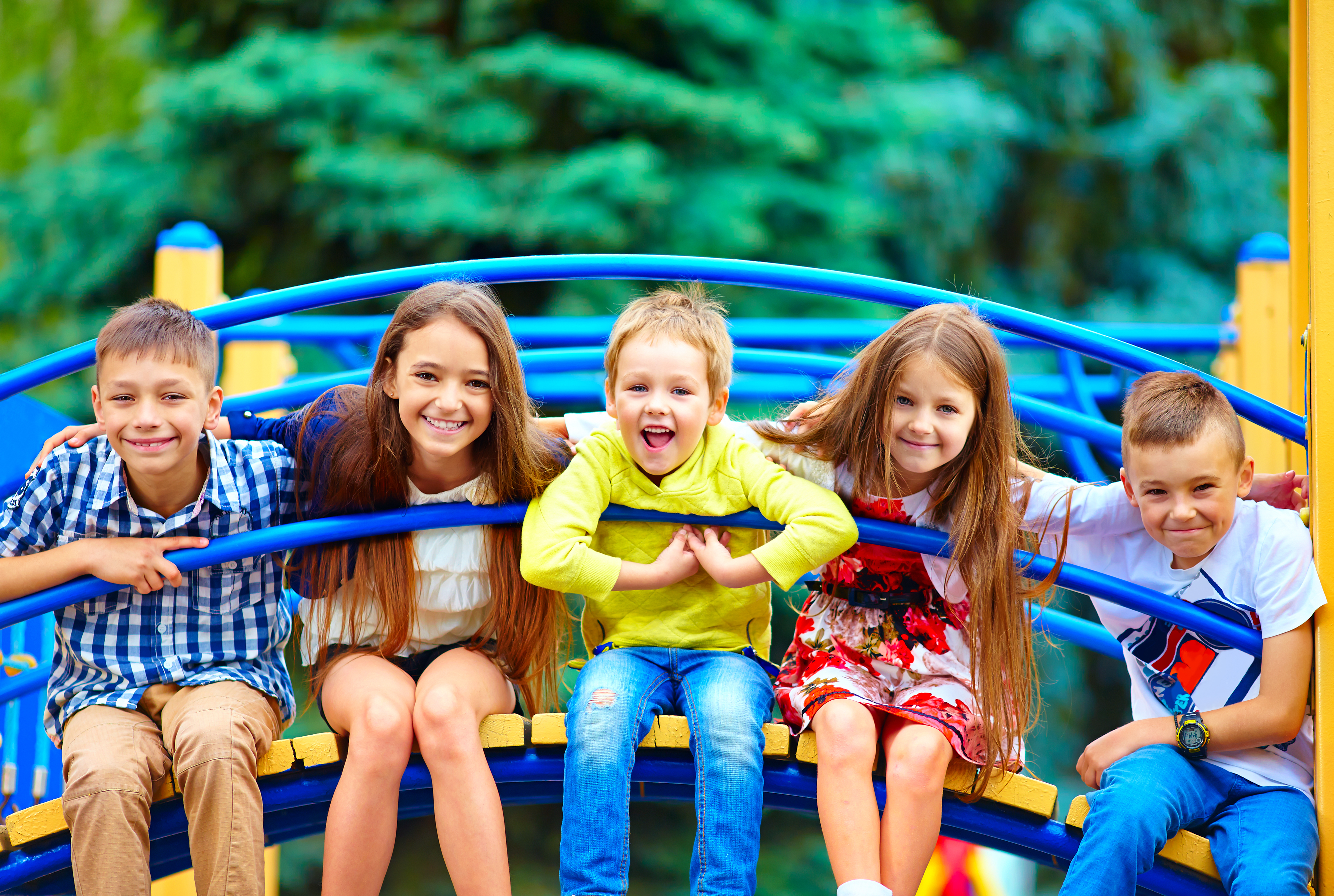 group of happy kids having fun on playground
